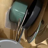 Customer-uploaded image. Click to see more details. The image represents: Kitchen sink filled with various pots, pans, and dishes waiting to be washed