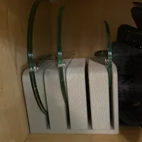 Customer-uploaded image. Click to see more details. The image represents: A gray fabric file organizer with vertical slots holding green cables or cords, sitting on a wooden shelf