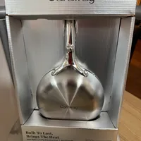 Customer-uploaded image. Click to see more details. The image represents: Caraway brand stainless steel mini fry pan in retail packaging, displayed in a white box with product information visible on the front.
