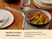 Caraway navy ceramic mini fry pan holding cooked carrots on a dining table.