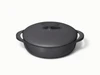 Caraway 3.5 qt enameled cast iron braiser in Charcoal with a matching lid.