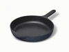 Caraway 10.5” enameled cast iron skillet in Midnight.