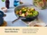 Caraway navy ceramic stir fry pan holding mixed vegetables on a dining table.