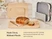 Caraway wooden cutting boards displayed beside sliced bread and organized cookware.