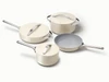 Caraway ceramic cookware set in Cream with four pans, three matching lids.