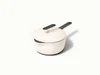 Caraway 1.8 qt enameled cast iron mini sauce pan in Cream with a matching lid.