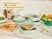 Caraway sage ceramic food storage containers holding prepared food and stacked on a kitchen counter.
