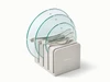 Caraway glass lid set of 3 with silver-tone handles with lids arranged in a storage organizer.