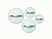 Four clear glass cookware lids with silver-tone handles, viewed from above.