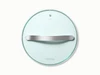 Caraway 10.5-inch glass cookware lid with silver-tone handles.