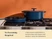 Caraway navy enameled cast iron large skillet and lidded oval Dutch oven on a stove.