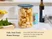 Caraway large glass airtight container with a Navy lid holding tube-shaped pasta on a counter.