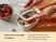 Hands placing a clear lid on a Cream mini rectangle container filled with yogurt and berries.