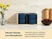 Caraway navy mini food storage containers stacked in countertop organizers.
