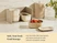 Caraway cream mini food storage containers stacked in an organizer beside strawberries.