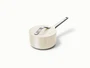 Caraway ceramic mini sauce pan in Cream with a matching lid.