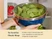 Hands carrying a Navy mixing bowl of lettuce covered with a glass lid into a refrigerator.