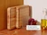 Two wooden butcher blocks stored upright in a countertop organizer.