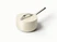 Caraway ceramic sauce pan in Cream with a matching lid.