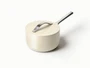 Caraway ceramic sauce pan in Cream with a matching lid.