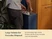 Person removing a full trash bag from a Navy slim trash can.