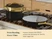 Caraway black ceramic cookware with gold-tone handles and a small steamer insert on a stove.