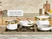 Caraway white ceramic cookware and gold-tone steamer inserts arranged on a stove.