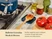 Caraway navy spoon rest holding a wooden spoon with tomato sauce beside a stove.