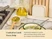 Caraway cream spoon rest holding a wooden utensil beside a bowl and stove.