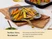 Caraway black square ceramic griddle with a gold-tone handle holding colorful roasted carrots.