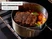 Caraway stainless steel Dutch oven roasting meat and vegetables in an oven.