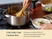 Hand stirring a cooked meal in a stainless steel Dutch oven beside a bowl of rice.