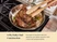 Caraway wooden tongs turning a steak in a stainless steel fry pan on a stove.