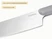 Caraway close-up of a stainless steel kitchen knife blade and Gray handle.