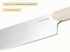 Caraway close-up of a stainless steel kitchen knife blade and Cream handle.