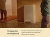 Caraway light-colored trash can beside a kitchen island in an open room.